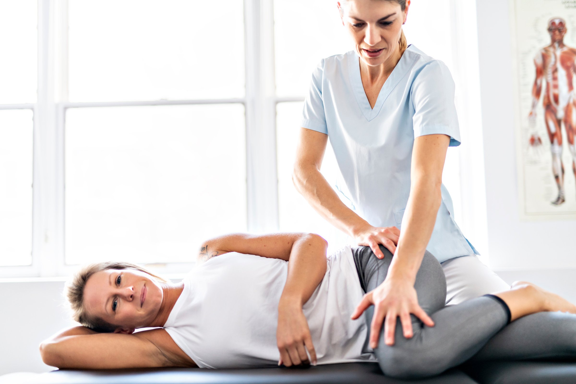 A Modern rehabilitation physiotherapy worker with woman client